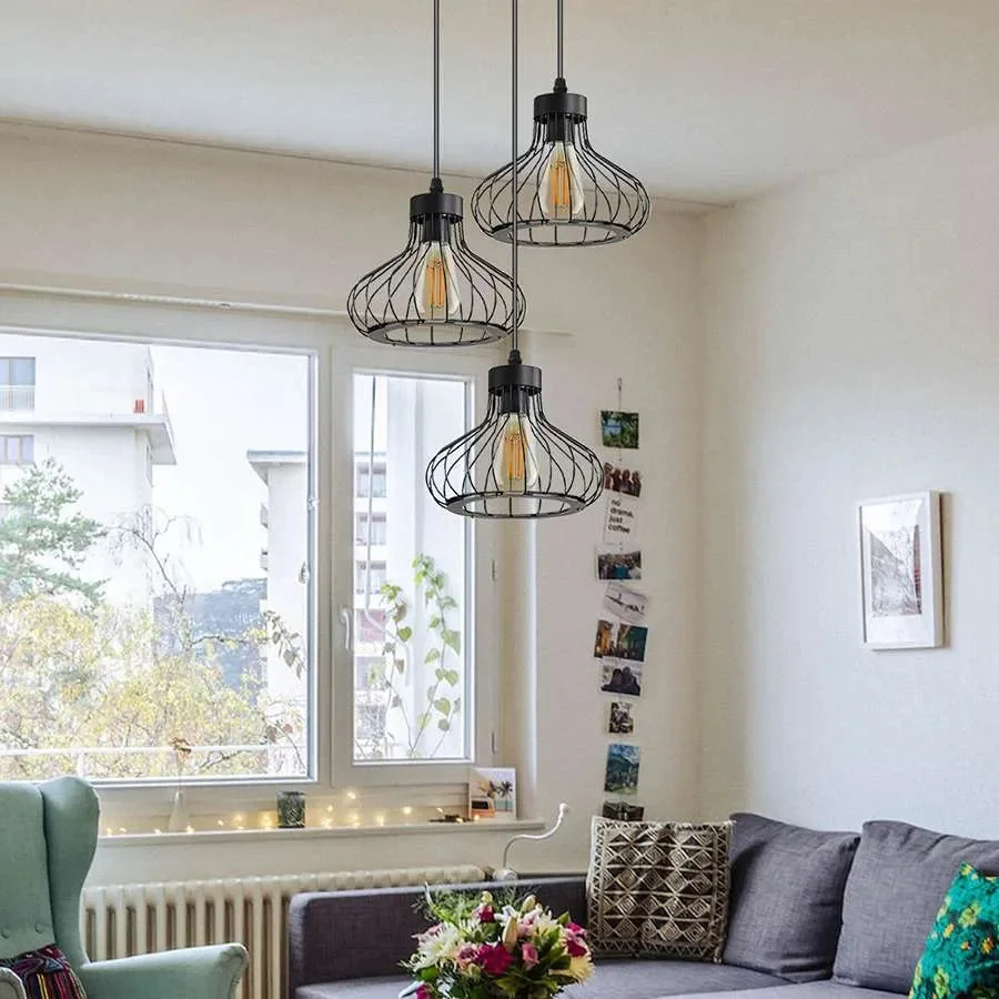 Three light cluster pendant with black wire cages and adjustable cables in an industrial retro style ceiling light fixture