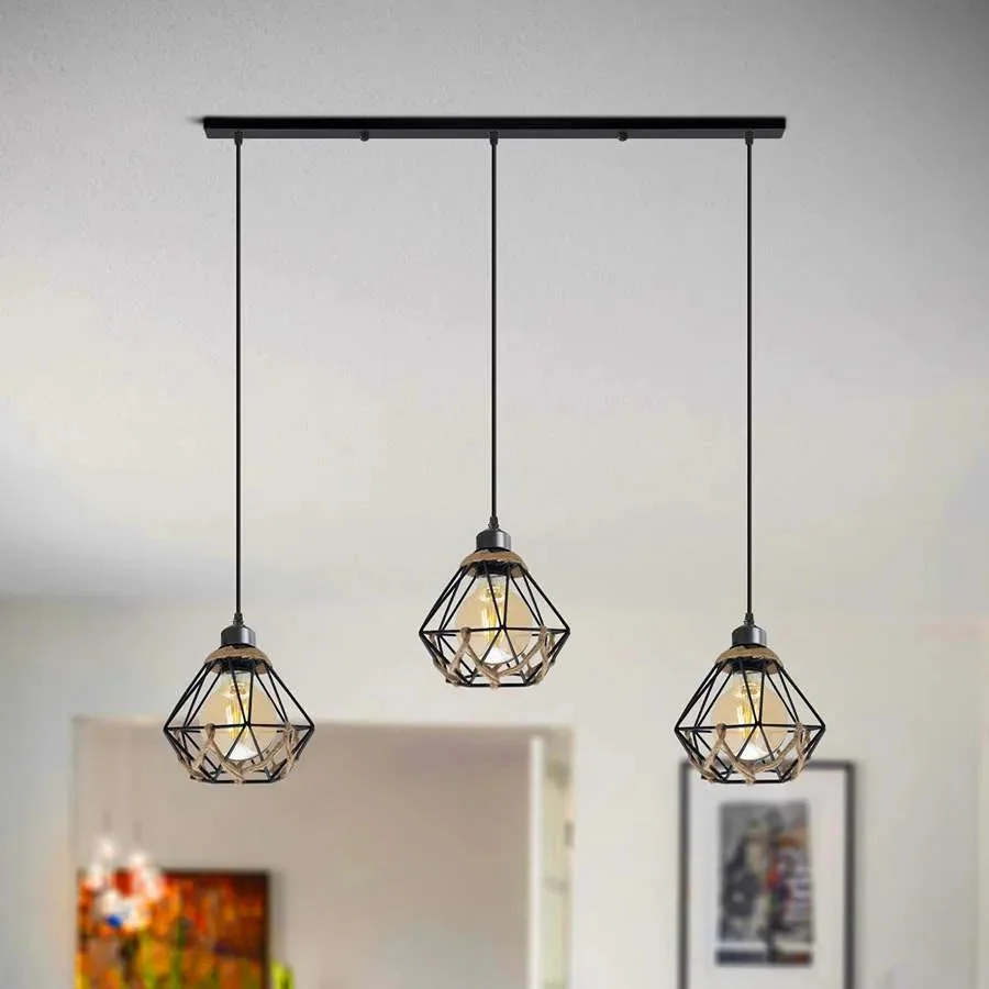 Three-light industrial pendant light with metal cages and hemp rope detailing hanging from adjustable cables