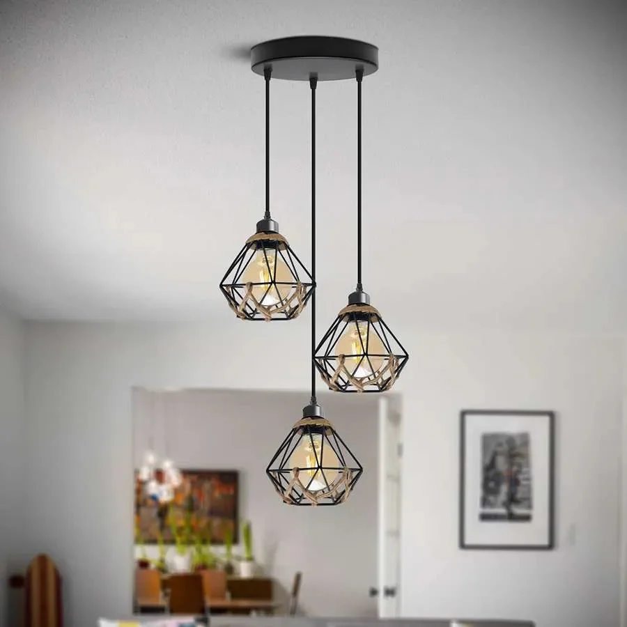 Three light industrial cluster pendant light with metal cage shades and hemp rope cables hanging from ceiling rose