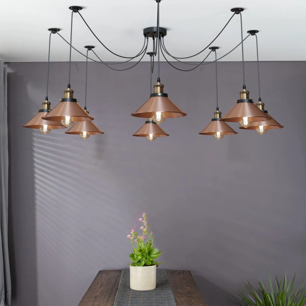 Vintage industrial 8 way spider pendant light with eight metal cone shades and black ceiling mount, hanging cables visible