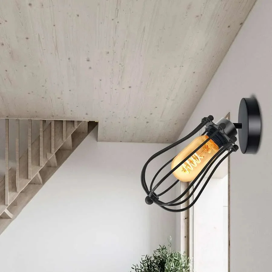 Vintage metal balloon-shaped adjustable wall light with wire cage and E27 bulb holder mounted on white wall