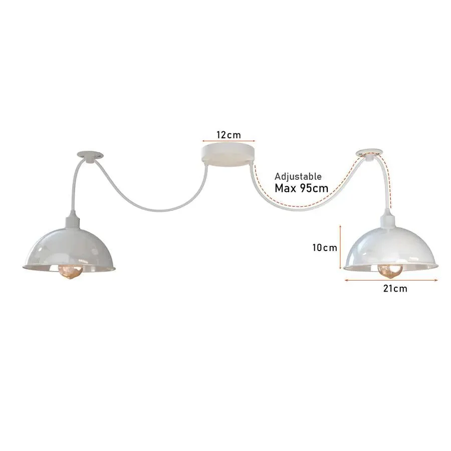 White industrial spider pendant light with two adjustable metal shades hanging from ceiling cables