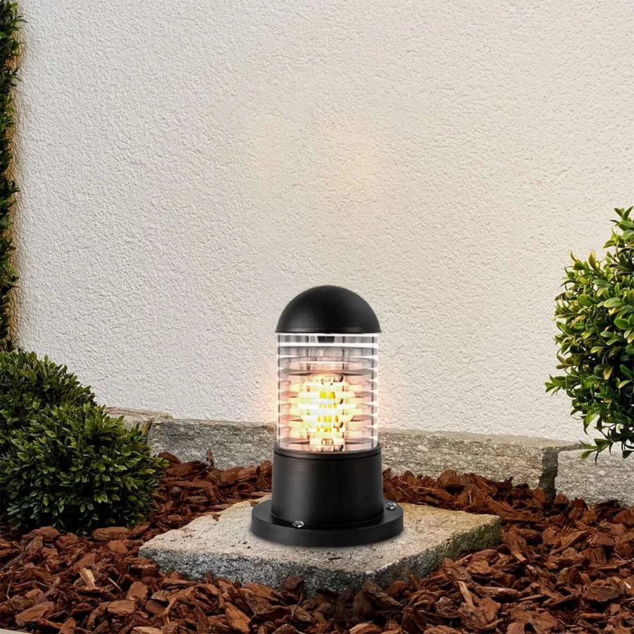 Modern black outdoor bollard light with cylindrical glass shade and ABS body, suitable for garden and patio lighting