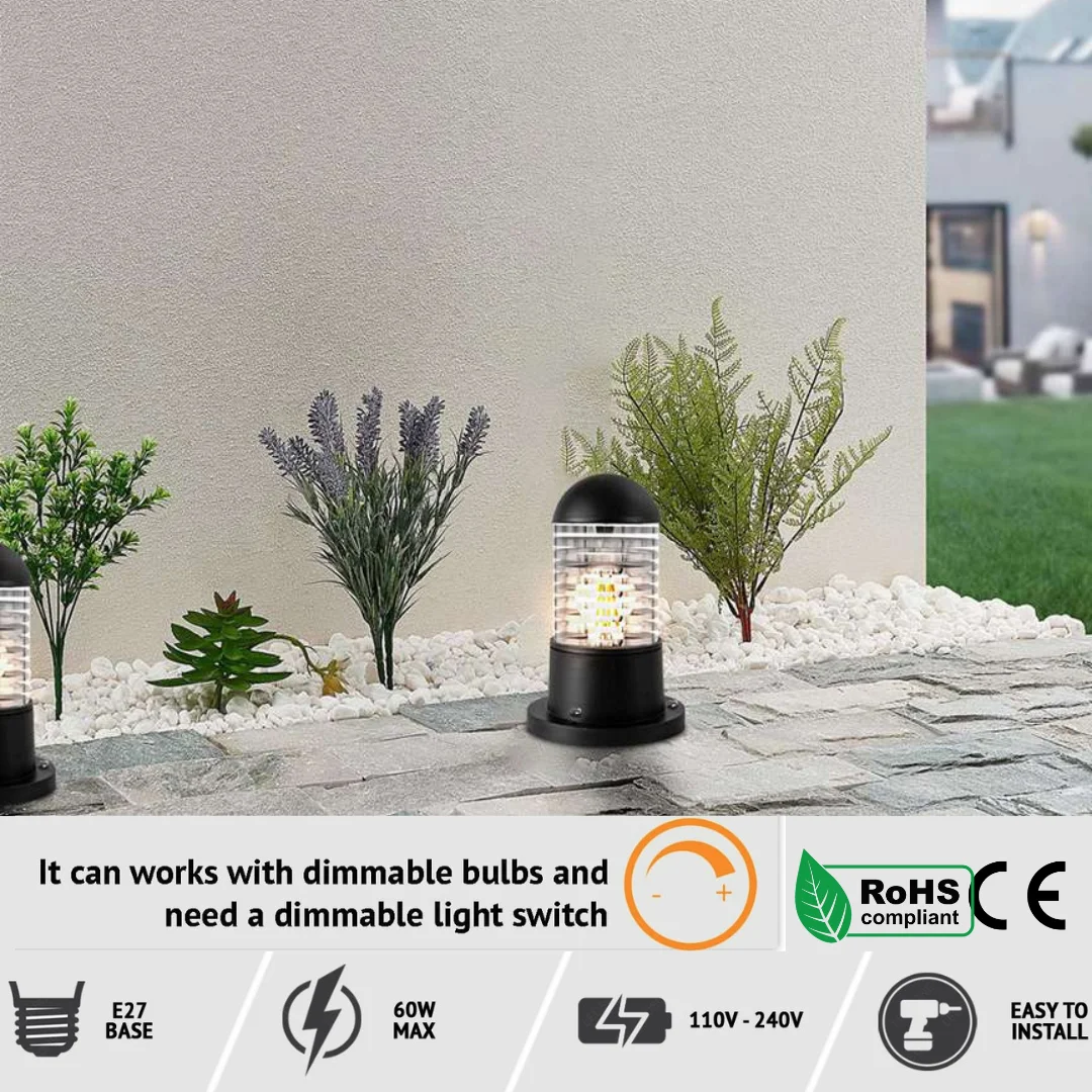 Black garden light bollard with cylindrical ABS body and rippled glass shade, mounted outdoors on a patio floor