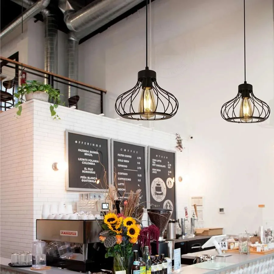Black metal cage pendant light hanging from ceiling with visible bulb inside, suitable for indoor vintage lighting decor