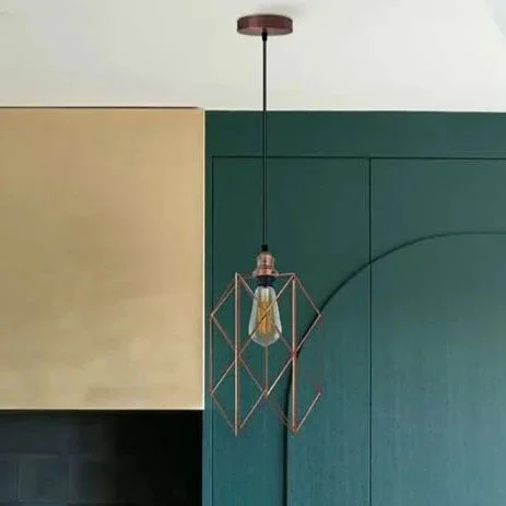 Copper finish metal cage pendant light with vintage style hanging from ceiling, featuring E27 bulb holder and black cable