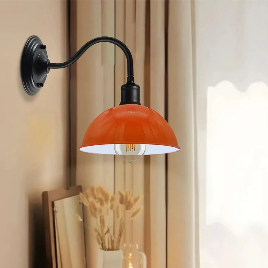 Industrial wall lamp with curved swan neck arm and metal dome shade, mounted on a wall, vintage industrial style