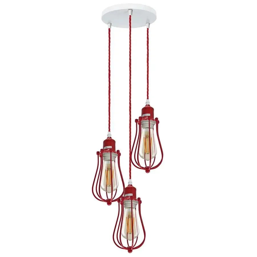 Three red cage pendant light heads hanging from a single ceiling mount with metal cages and exposed bulbs