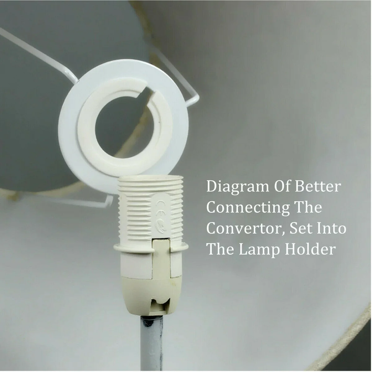 White plastic lamp shade ring reducer showing 46mm outer and 29mm inner diameters on a plain background