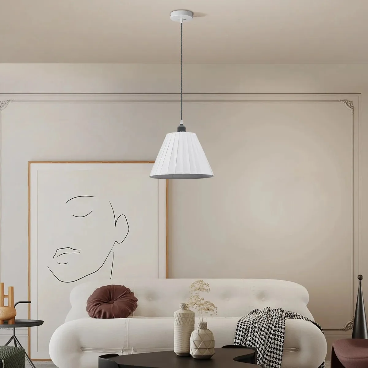 Contemporary ceiling mounted lamp with white pleated fabric shade and metal frame, hanging from ceiling with fabric-covered cable