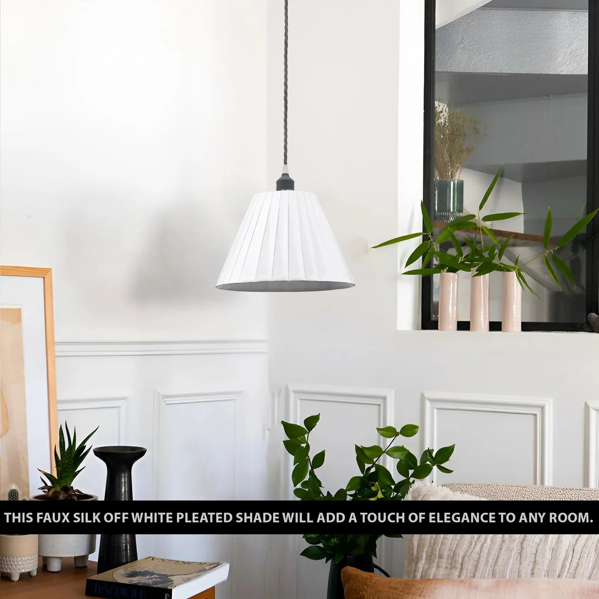 Modern pendant light with white pleated fabric lampshade and metal frame, hanging from ceiling with fabric-covered cable