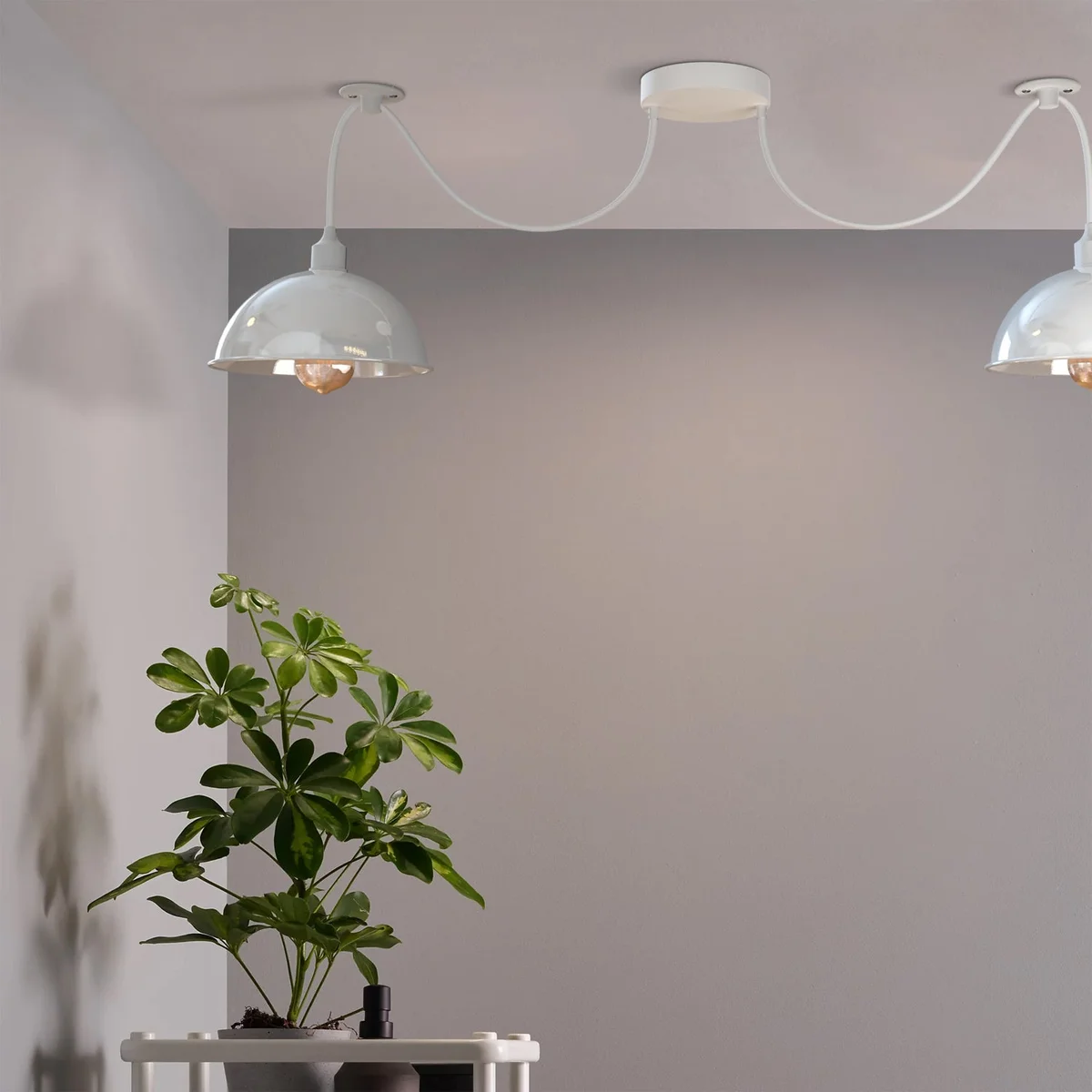 White metal spider pendant light with two adjustable shades and dimmer switch, ideal for modern industrial interiors