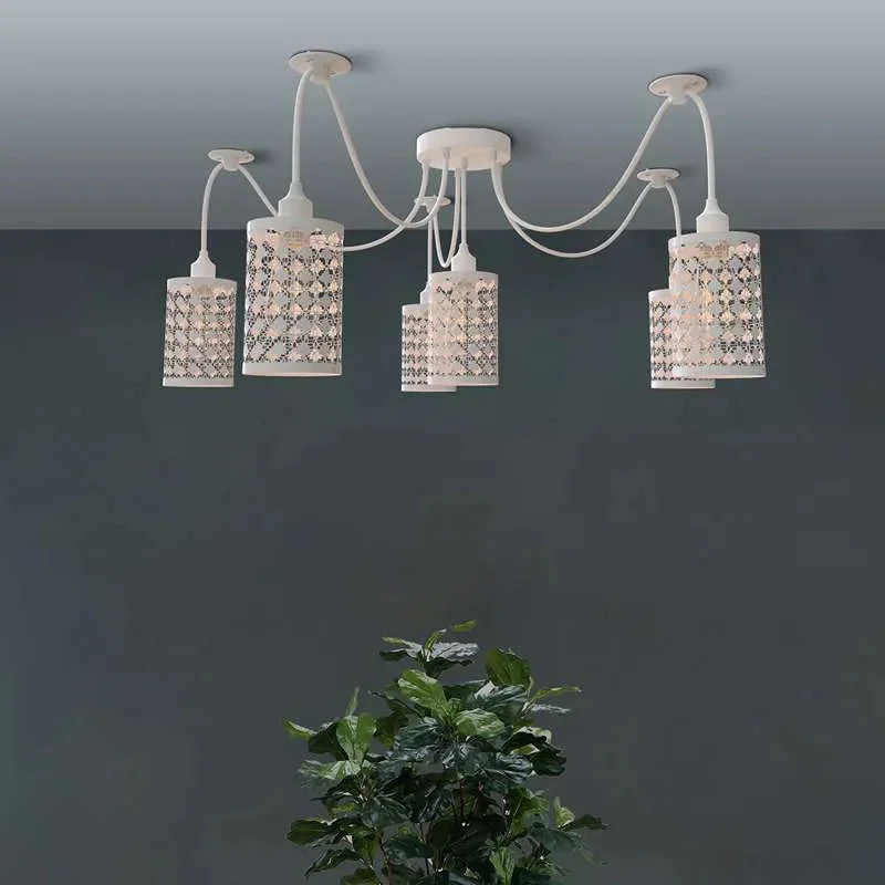 White 6 way spider ceiling light with six adjustable fabric-covered cables and metal wire cage shades hanging from ceiling plate