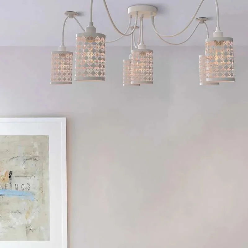 White 6 way spider ceiling light with adjustable fabric-covered cables and metal wire cage shades hanging from ceiling plate