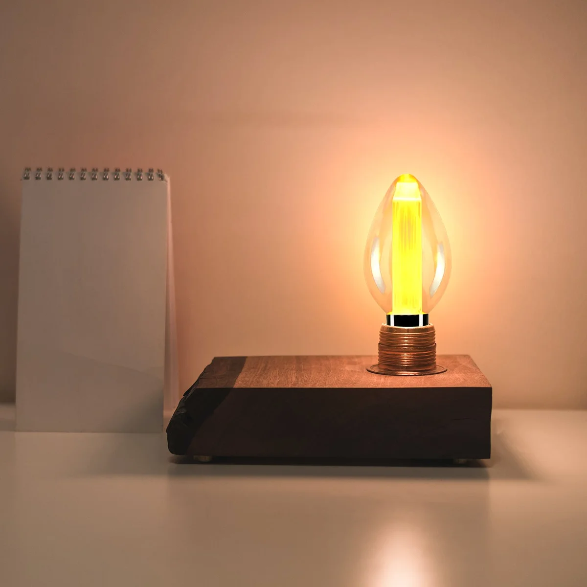 Vintage E27 LED bulb with amber glass and visible filament, 3W power, retro candle shape for decorative lighting