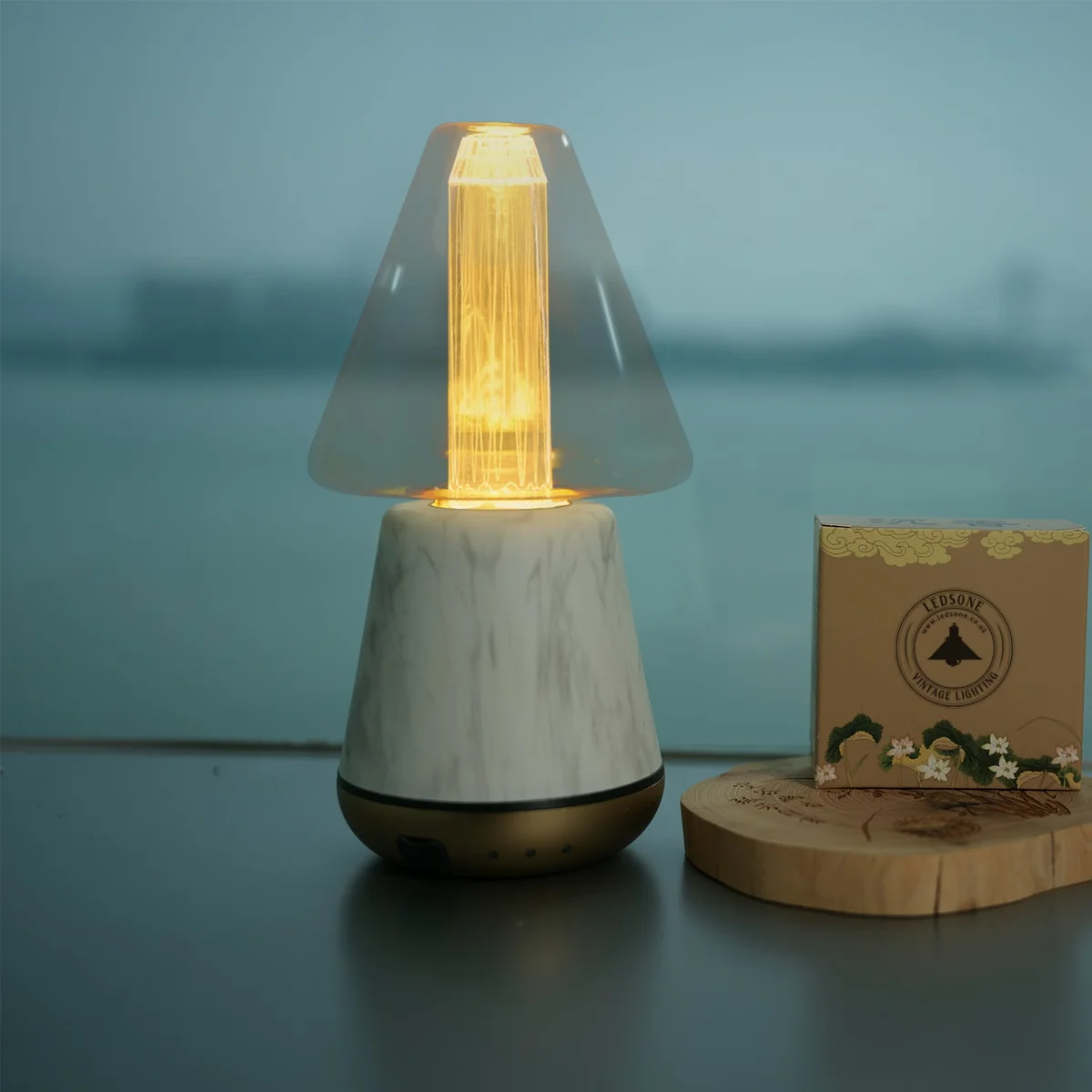 Vintage LED filament bulb with amber glass and cone shape, ideal for industrial and retro lighting fixtures