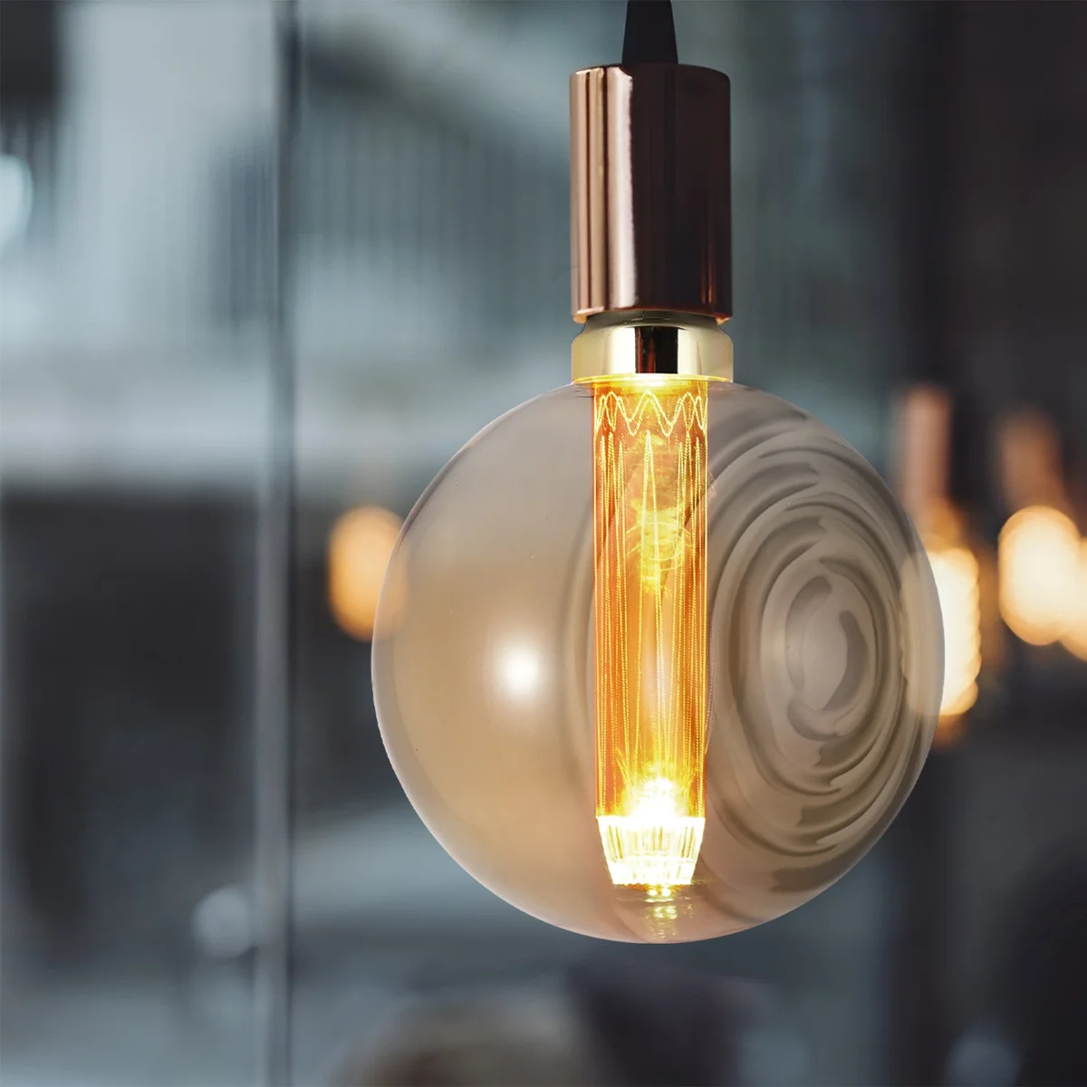 Vintage-style indoor LED globe bulb with E27 base, 3W power, warm white light, and clear glass globe shape