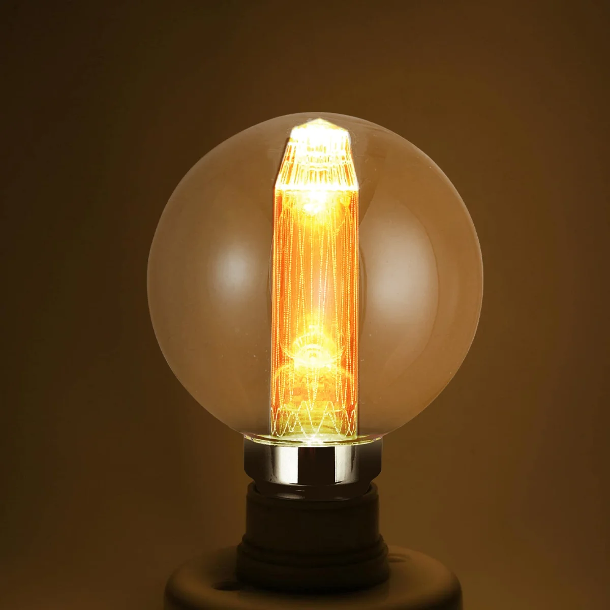 Vintage globe bulb with quad-loop filament, amber glass, glowing warm golden light, E27 screw base on black background