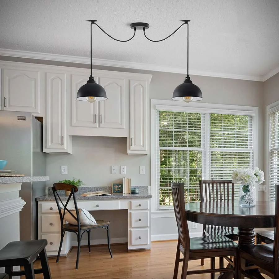 Black industrial style 2 head pendant ceiling light with adjustable 2M cables and dimmable bulbs hanging in living room setting
