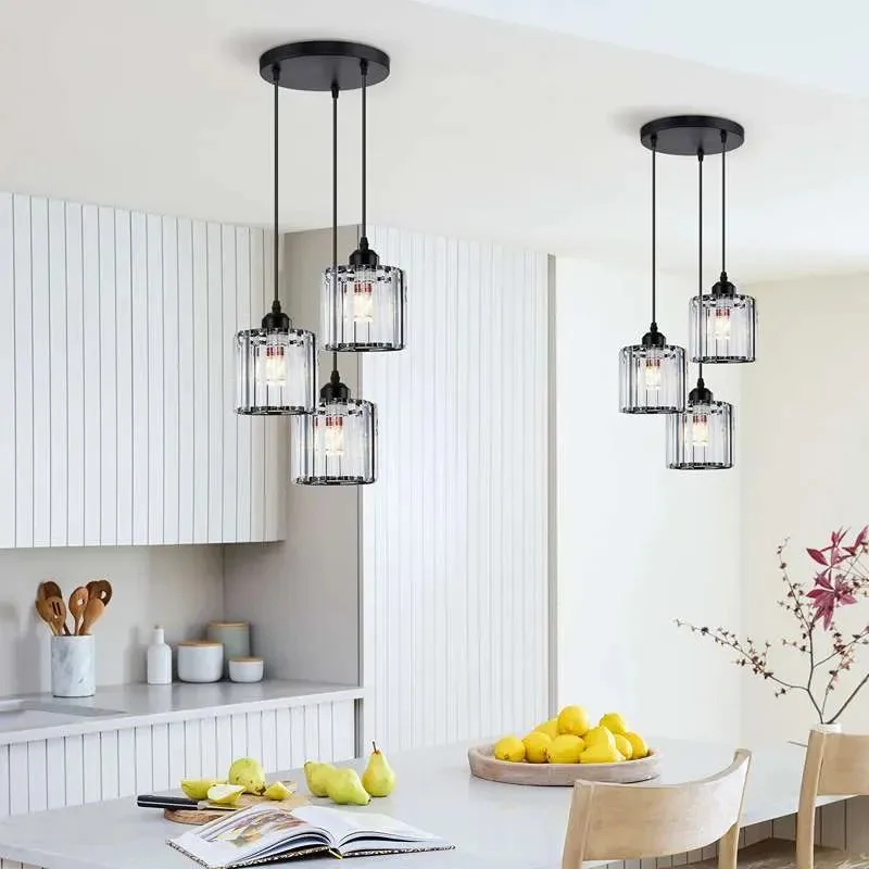 Modern crystal pendant light with three clear K9 crystal glass shades and black metal ceiling rose hanging from adjustable cable