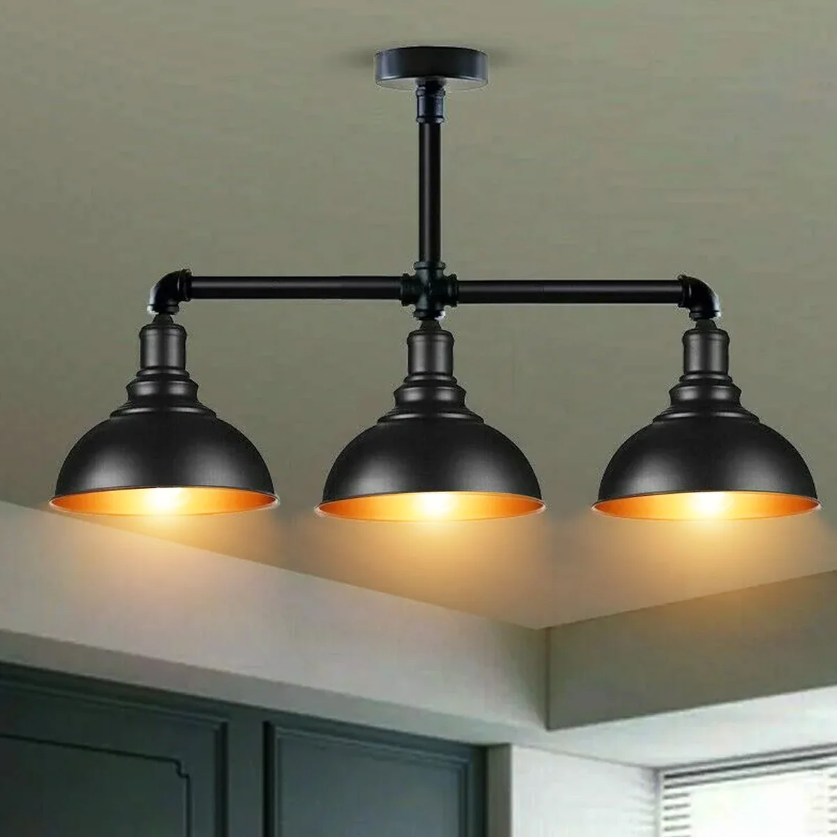 Industrial steampunk ceiling light with three black metal pipe arms and E27 bulb fittings in a vintage design