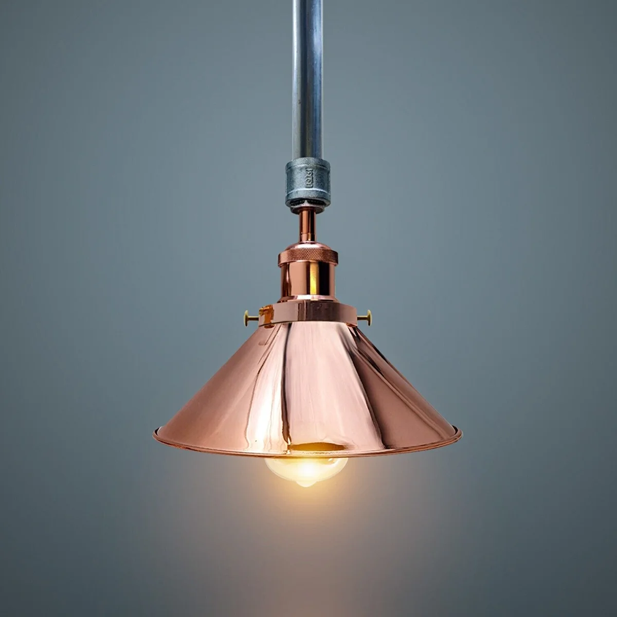 Galvanized metal industrial lighting pendant with rose gold accents and white interior shade, ceiling-mounted fixture view