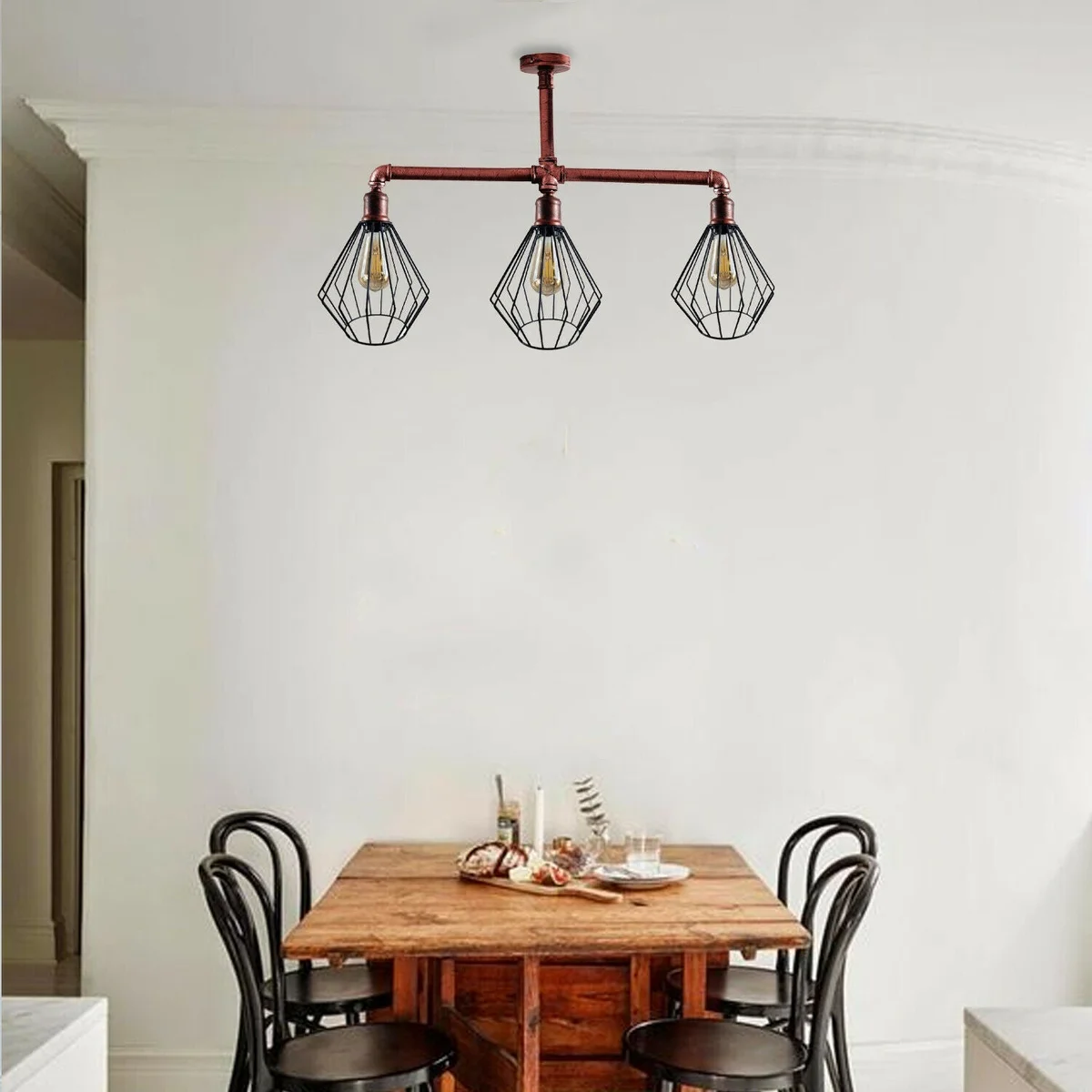 Vintage industrial 3-way adjustable height ceiling light with metal pipe arms and cage shades in brushed copper finish