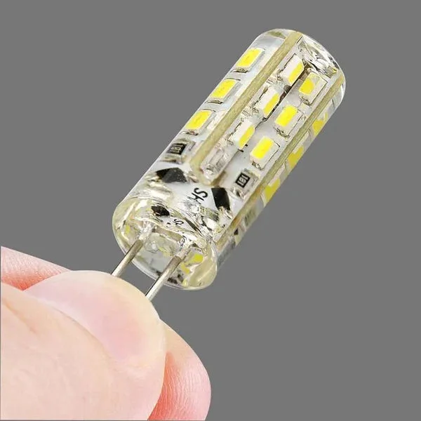 G4 LED capsule bulb with clear silicone housing showing 3W LED chip, 220V, warm and cool white light options