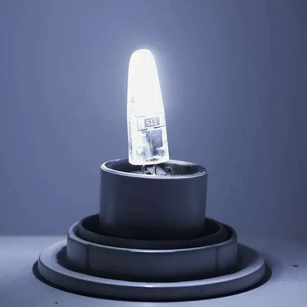 G4 3W warm white LED bulb with silicone capsule and two-pin base, shown against a white background