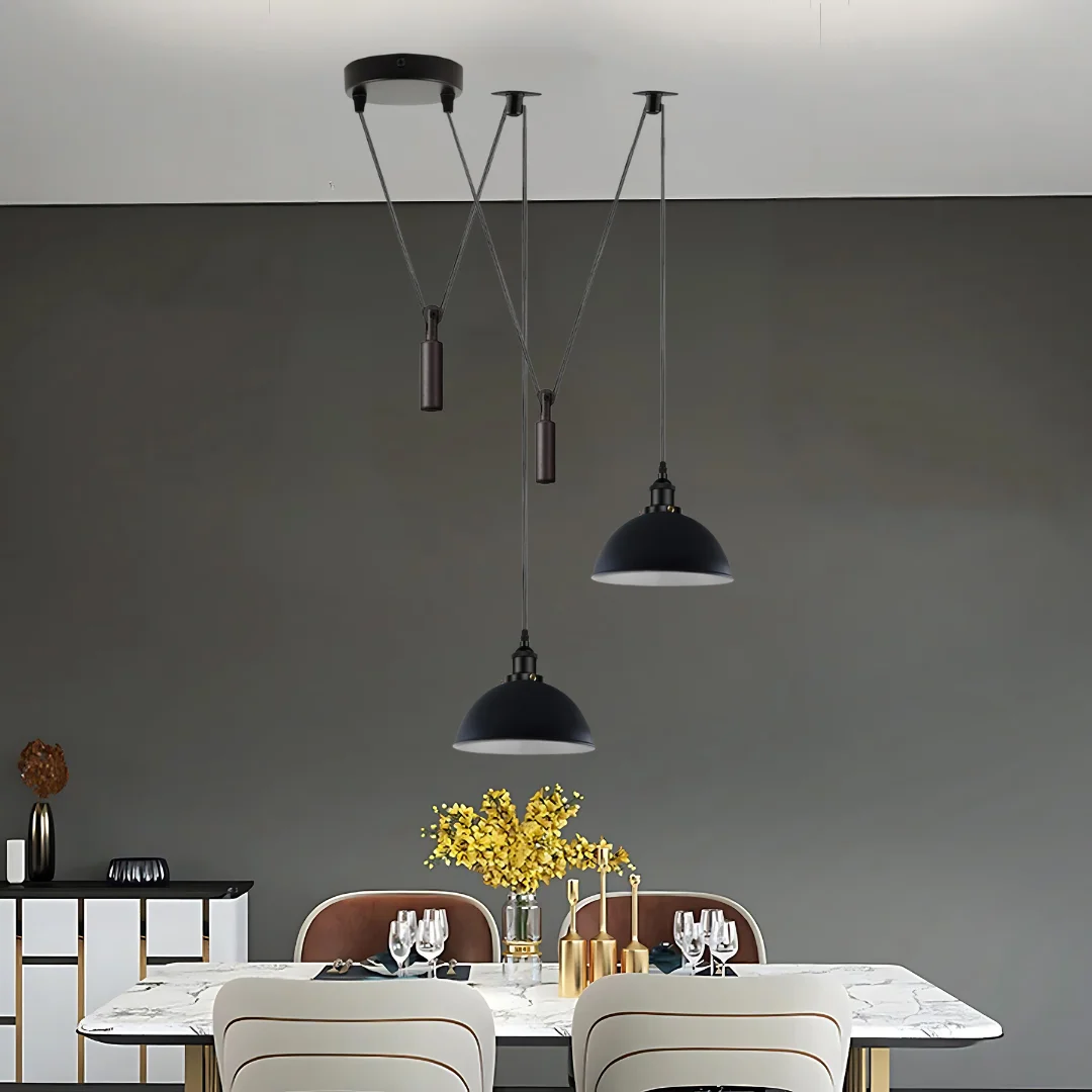 Black 2 head pendant ceiling light with adjustable cords and metal shades hanging from round ceiling mount