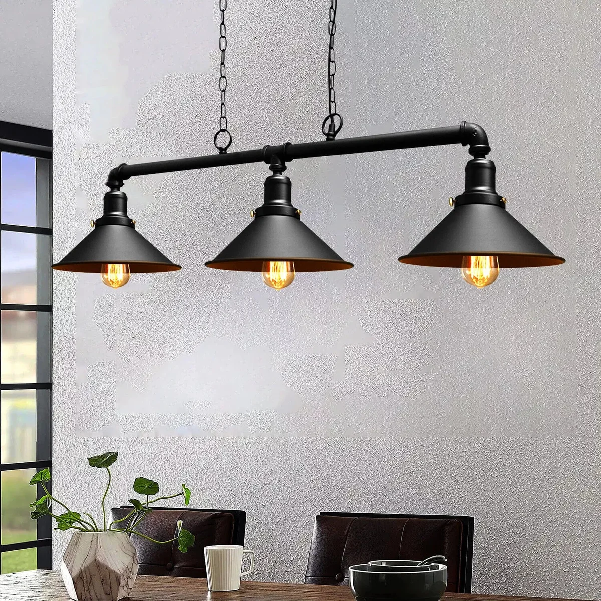 Three-lamp vintage ceiling pendant light in brushed copper metal with industrial water pipe design hanging from ceiling