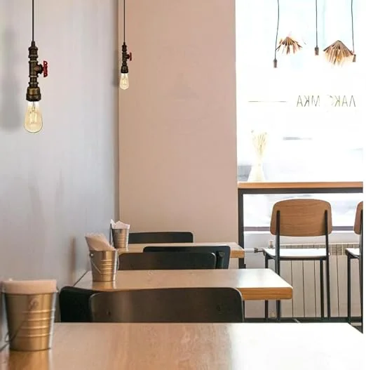 Brushed copper industrial pendant light with water pipe design and included E27 bulb, perfect for loft or vintage interiors