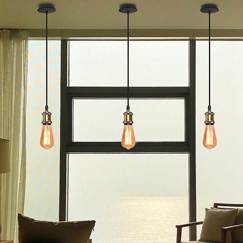 Yellow brass vintage E27 bulb pendant lamp holder with adjustable PVC cable and metal ceiling rose against white background