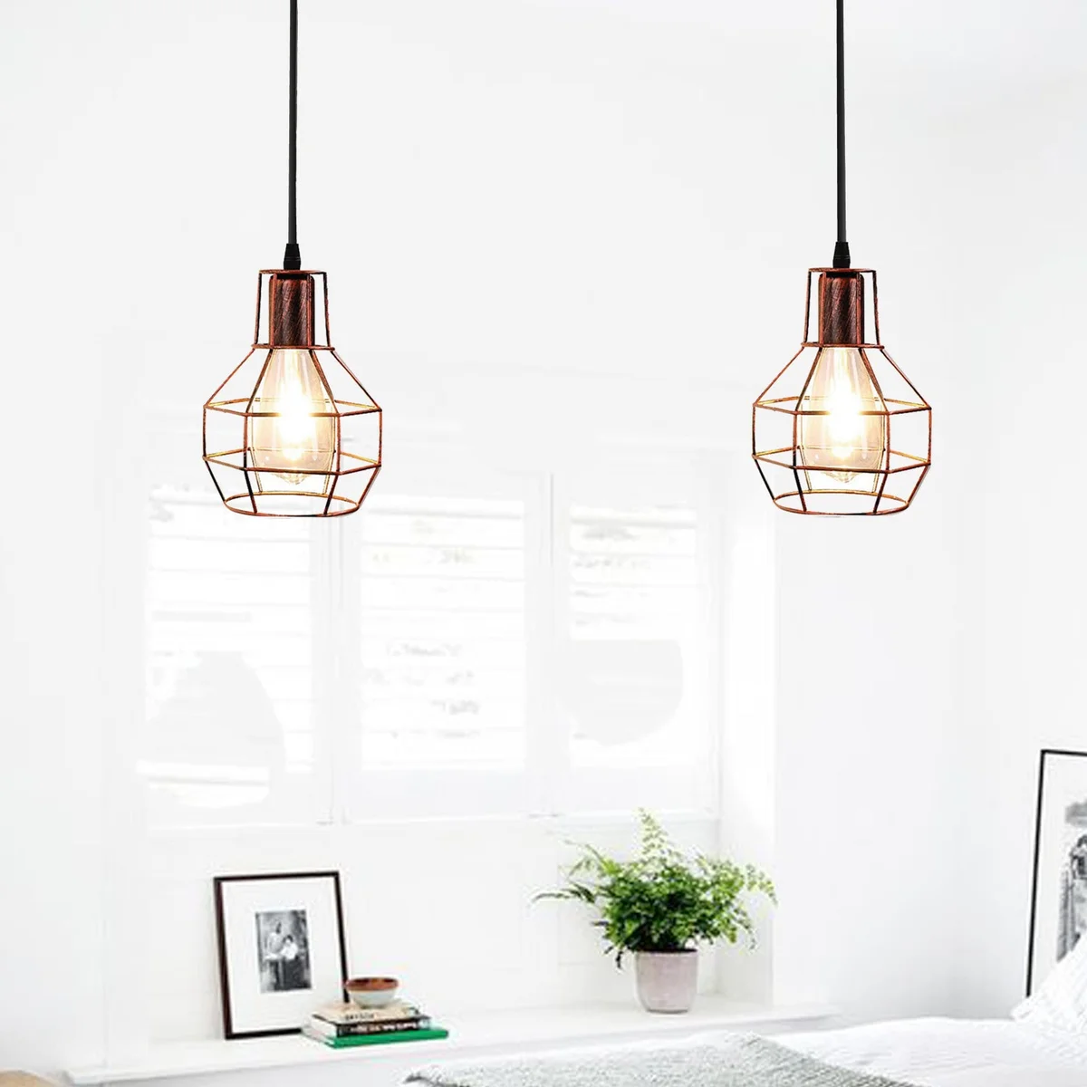 Rustic red industrial pendant light with two nest-shaped metal cages and 2-way spider pulley design hanging from ceiling