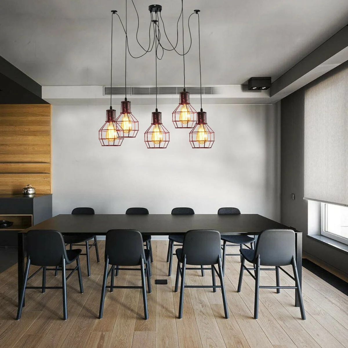 Vintage pendant light with five adjustable metal cage lampshades in a nest shape hanging from a round ceiling base
