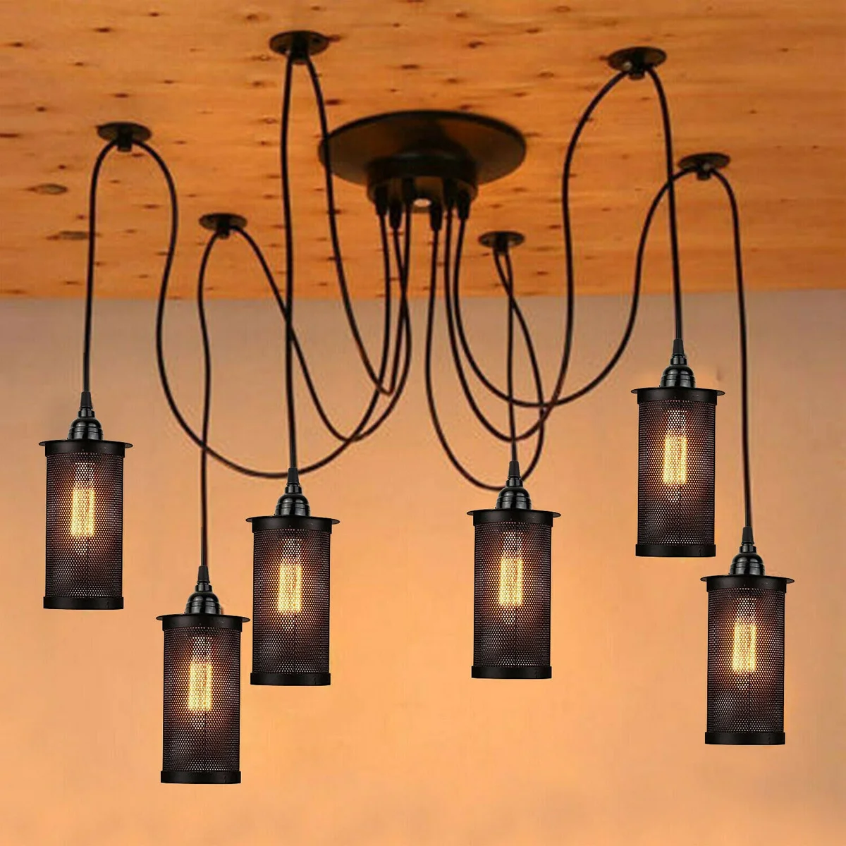 Black retro spider chandelier with six Edison-style filament bulbs and iron metal frame hanging from ceiling rose