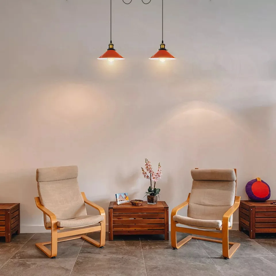Red retro industrial pendant lamp with metal cage shades and adjustable suspension cables hanging from ceiling plate
