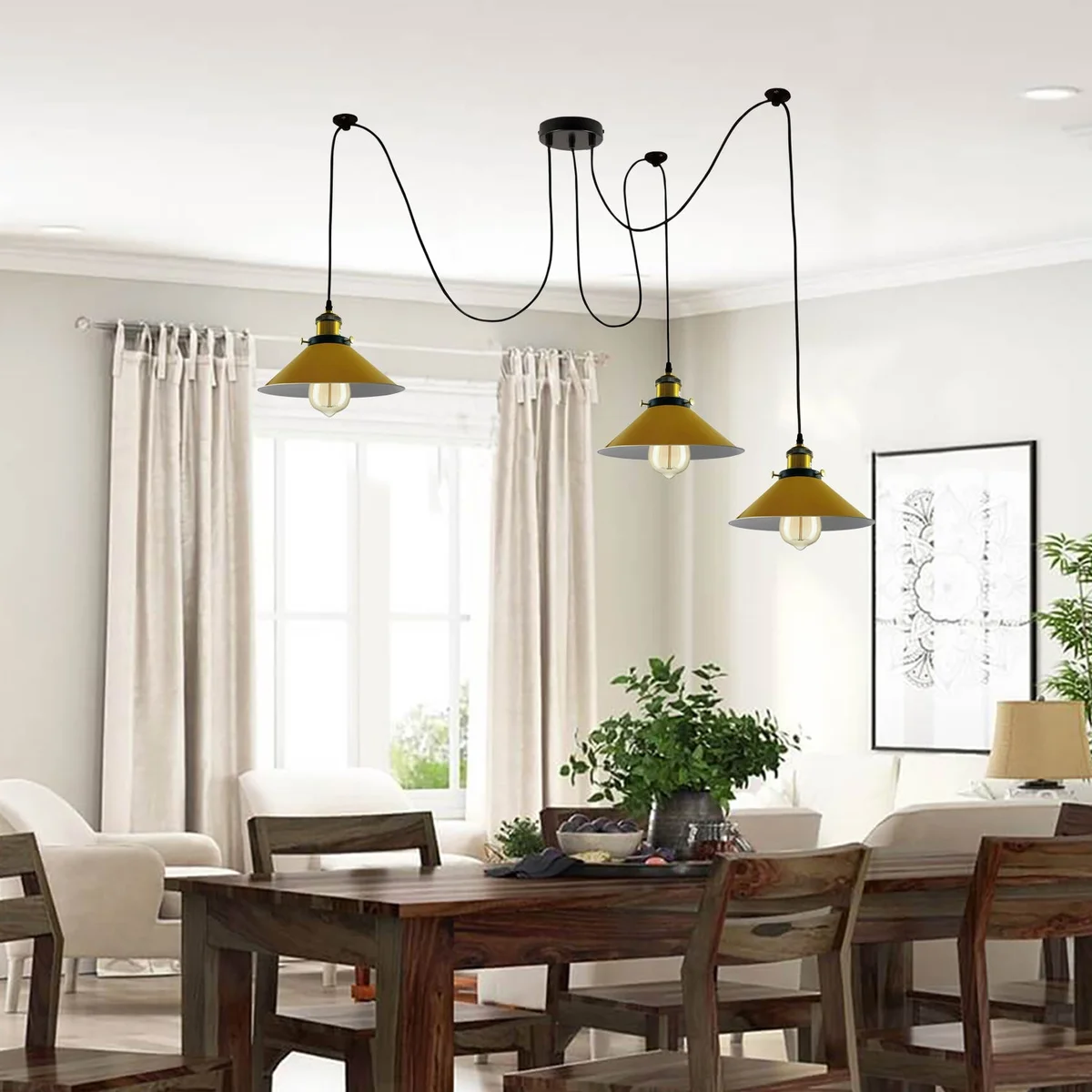 Modern spider pendant lamp with three yellow cone shades and braided cables hanging from ceiling rose