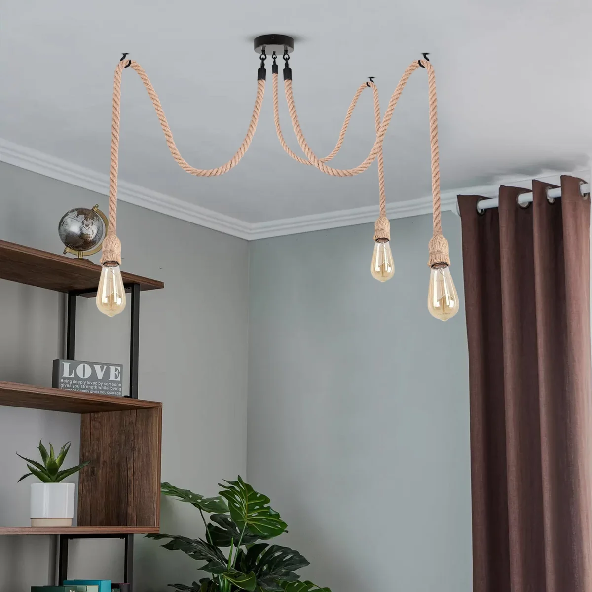 Black industrial hemp chandelier with three E27 bulb holders and hemp-wrapped cords hanging from ceiling plate