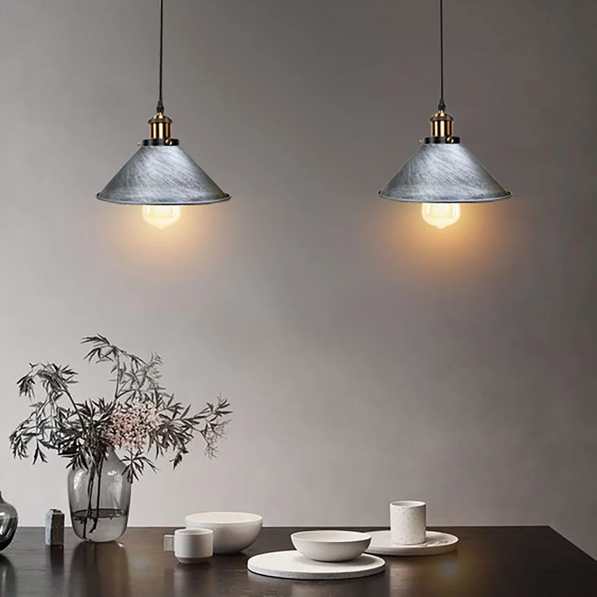 Colorful metal pendant lamps with retro industrial design hanging from ceiling with adjustable cables
