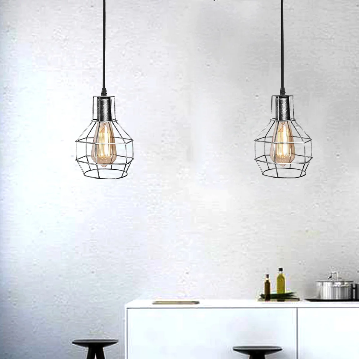 Brushed silver metal cage pendant light with spider shape and octopus-inspired ceiling mount in industrial style