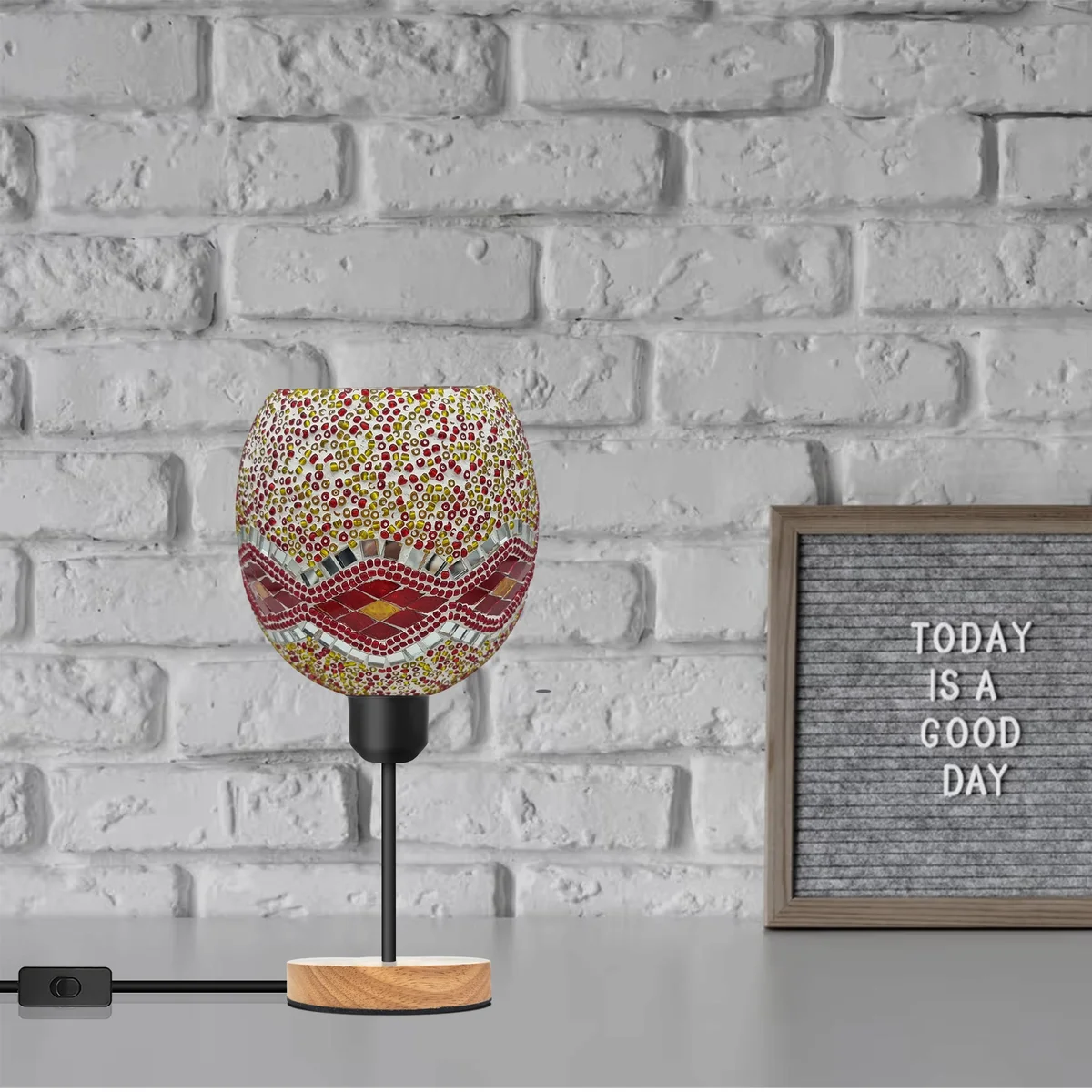Handcrafted mosaic table lamp with colourful stained glass globe shade, black metal holder, and natural wood base on white background