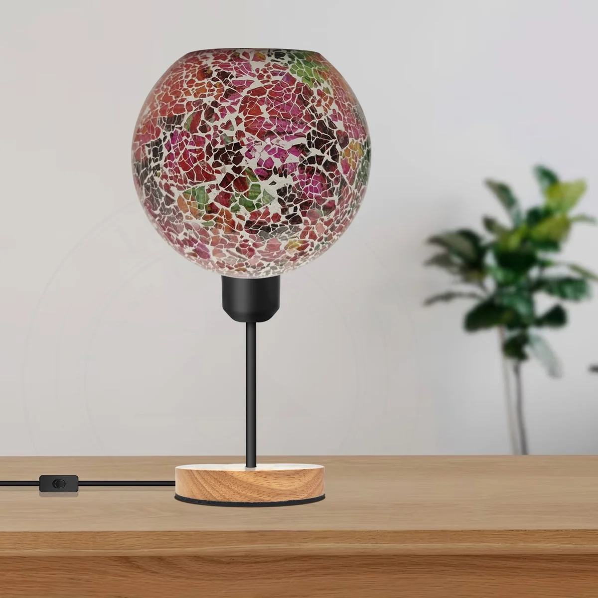 Colourful mosaic glass table lamp with stained glass tiles, black metal holder, and round wooden base on white background