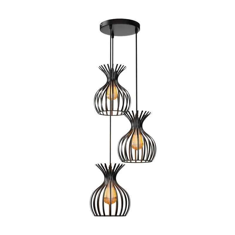 Black metal cluster pendant light with three wire cage shades, ideal for industrial pendant lighting over dining tables