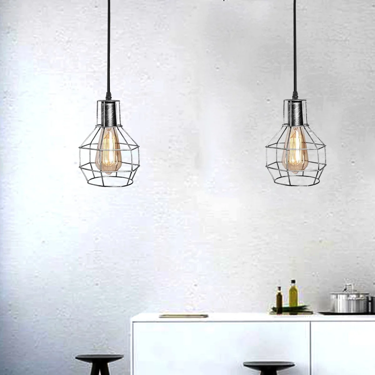 Black metal cage pendant light with two E27 lamp holders and adjustable hanging rope against white background