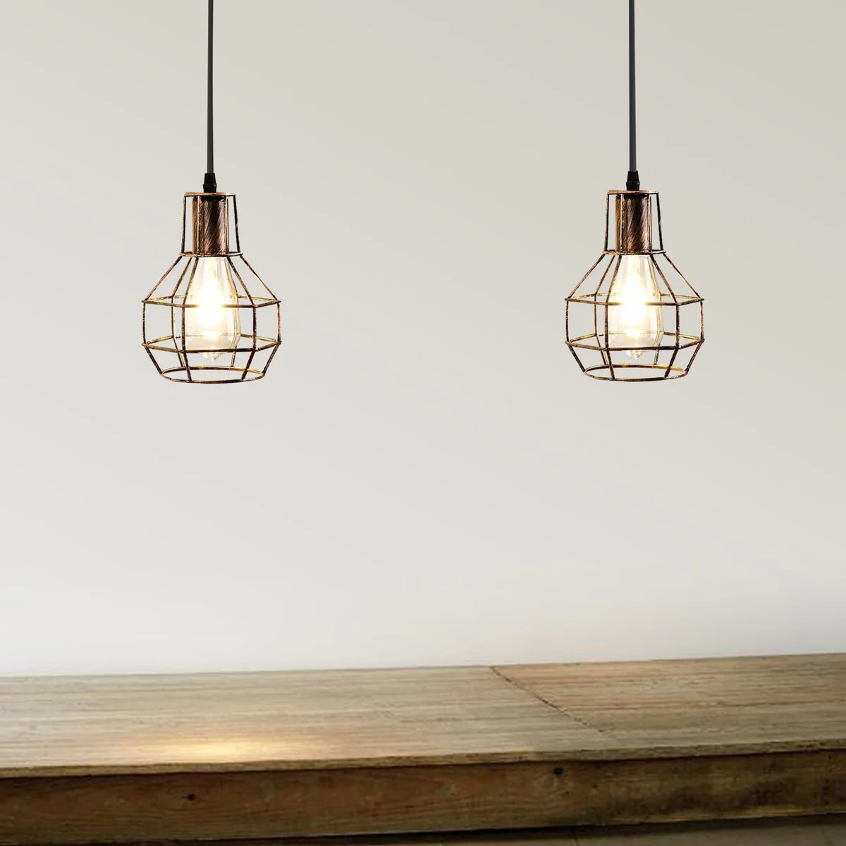 Black metal wire cage ceiling light with two bulbs, adjustable hanging rope, and industrial farmhouse style design