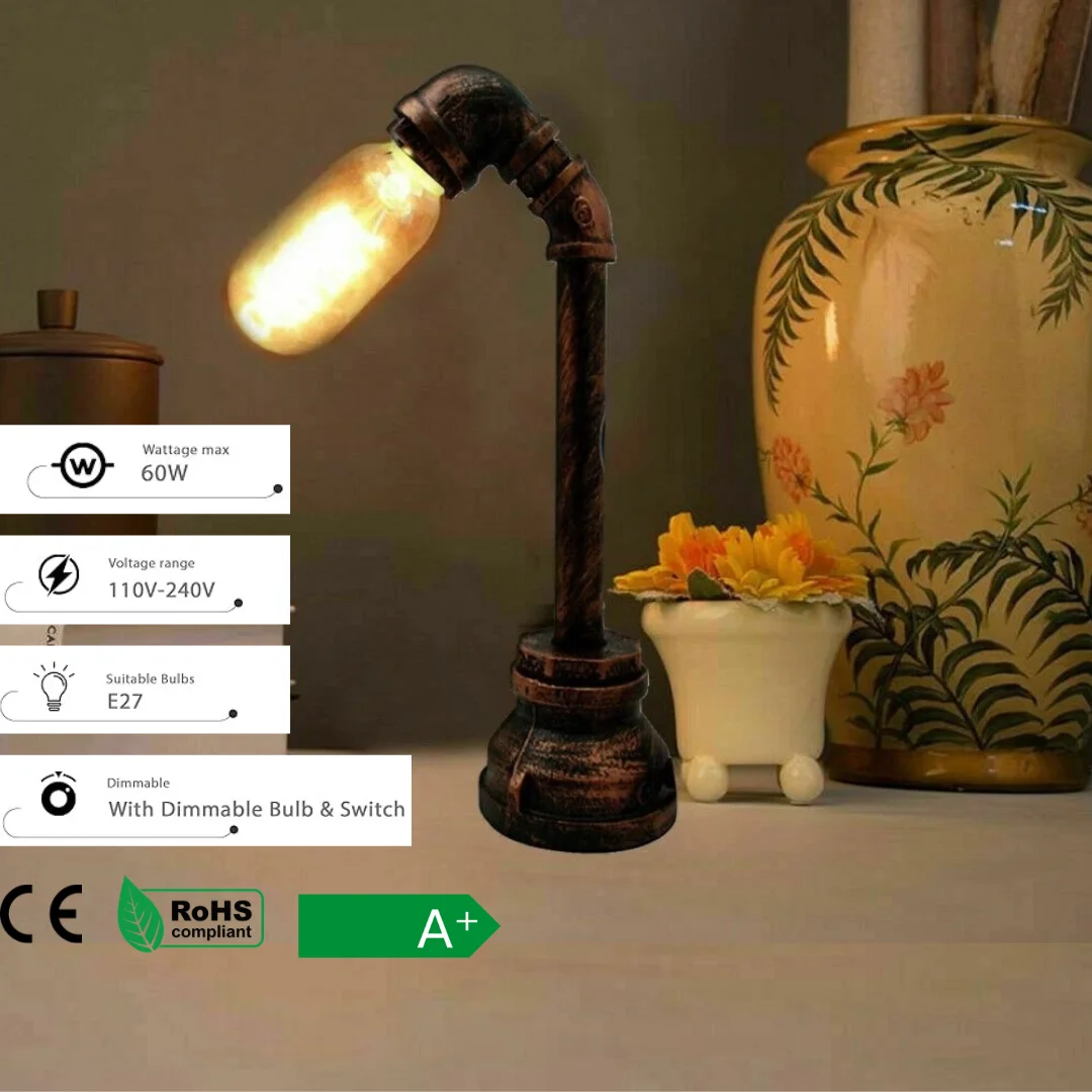 Vintage industrial style table lamp with water pipe design, brushed copper finish, and plug-in cord with switch on wooden desk
