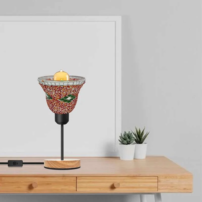 Handcrafted mosaic glass table lamp with colorful geometric shade, black metal holder, and wooden base on white background