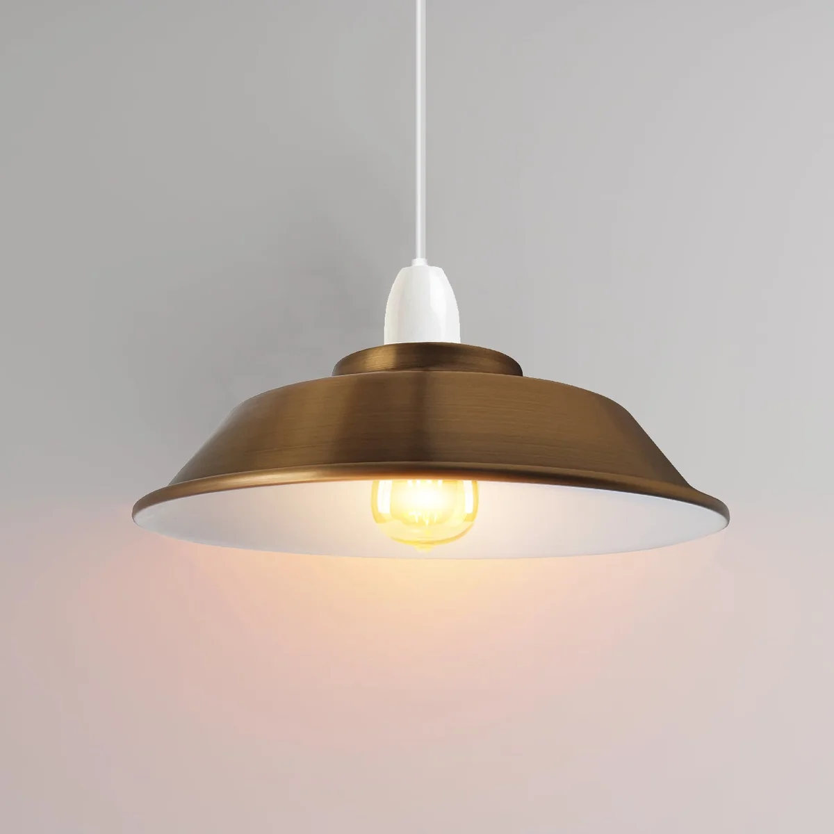 Yellow brass metal ceiling light with sleek dome shade and white interior for enhanced illumination, industrial style design