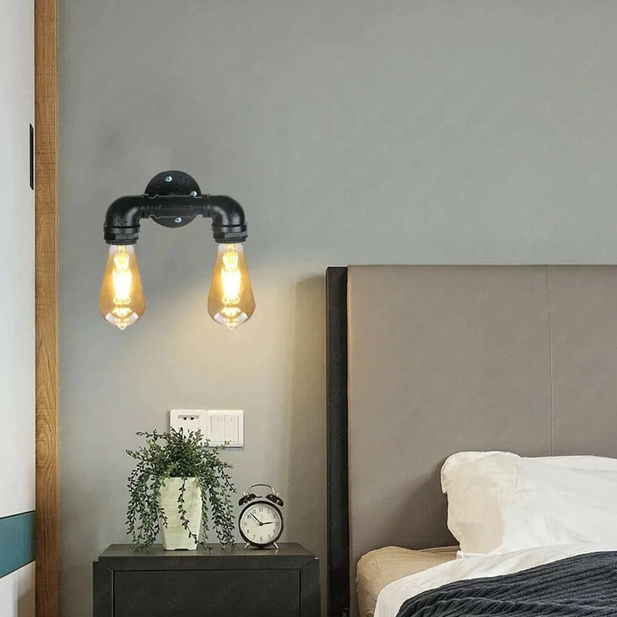 Vintage industrial wall light with dual E27 sockets, metal water pipe design in brushed silver finish mounted on wall